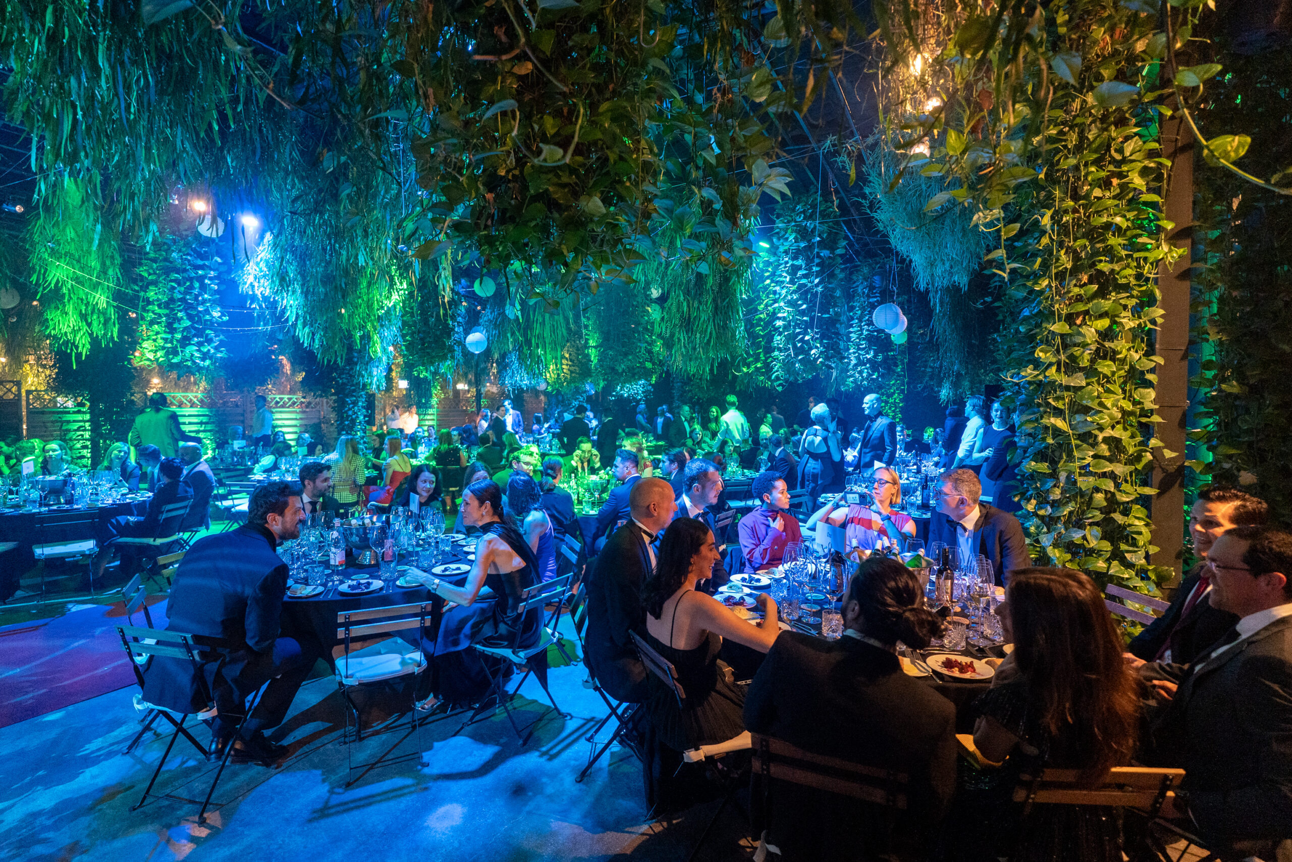 The Garden of Amsterdam event venue with tables and guests, World Sustainability Award Ceremony setting.