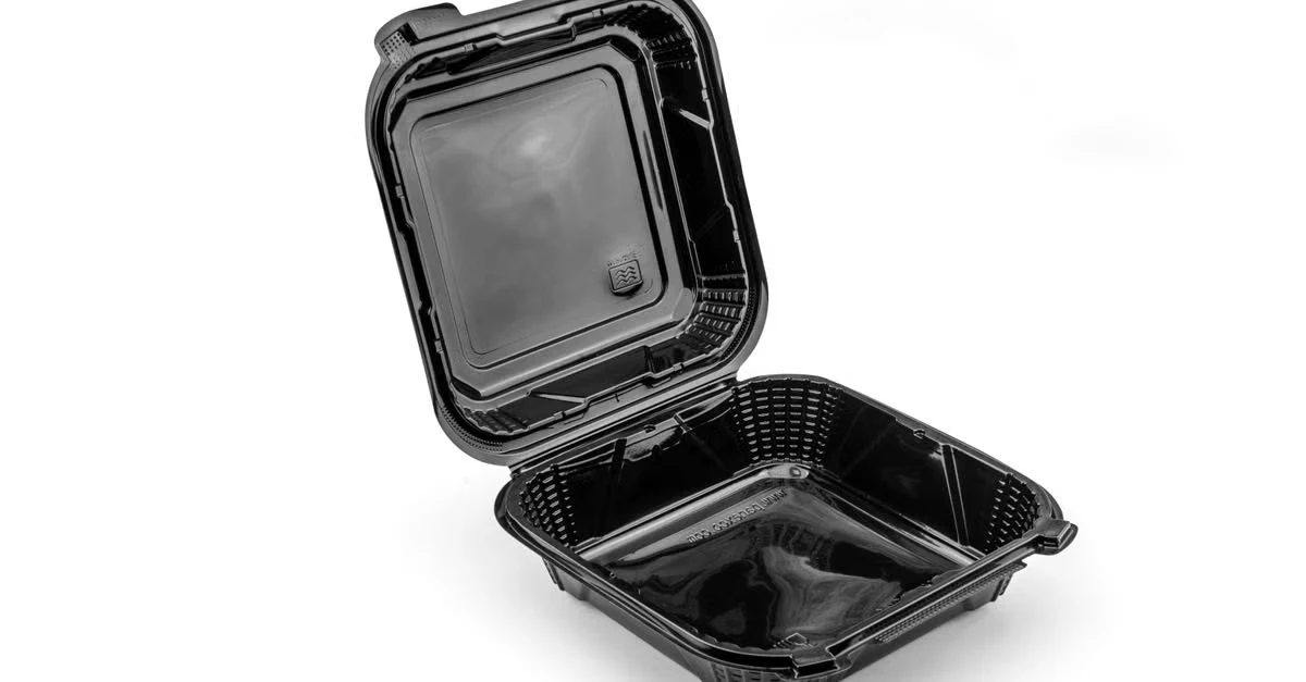 Open black hinged food container with clear lid for California SB54 foodservice compliance requirements.